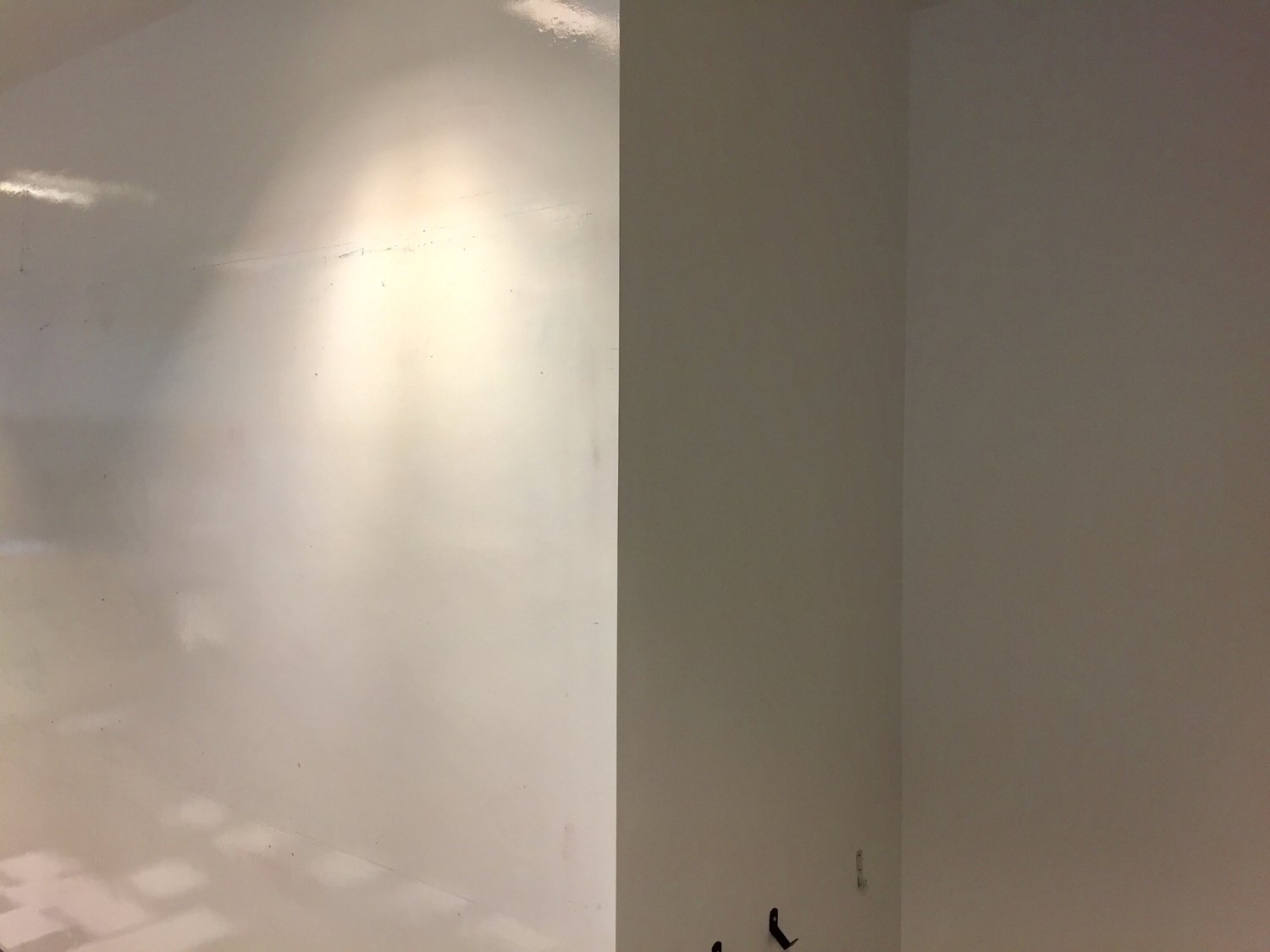 An image of white walls, some of which are white boards and others which are not.