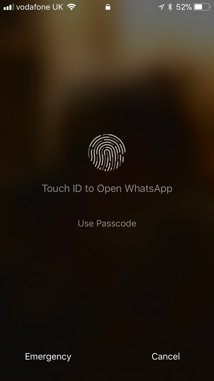 Apple iPhone unlock screen with touch ID as the primary action, displaying a button for using a passcode instead.